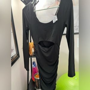 Fall or winter possibly chilly summer day black dress midsection reveal